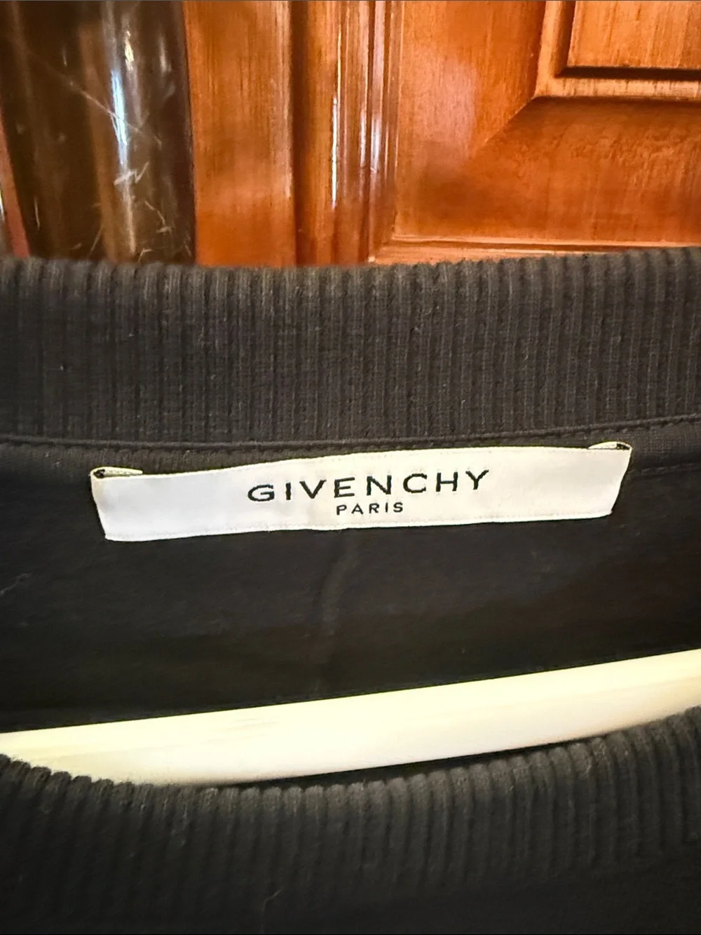 Givenchy Black Crewneck Sweater with White Star Circle and Red-Striped Sleeve